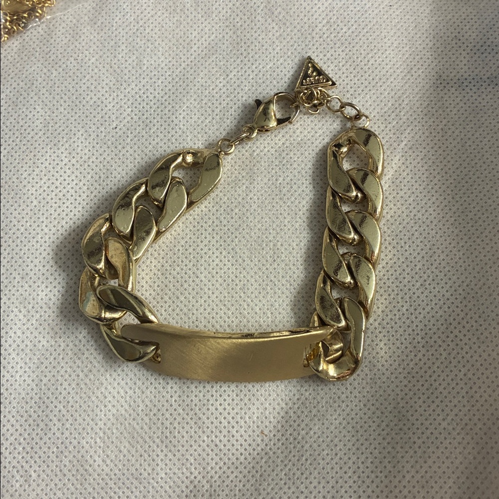 Guess gold tone name plate bracelet